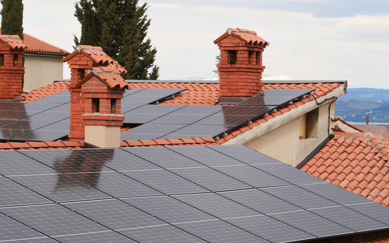 Solar photovoltaic panels installed on a tiled house roof